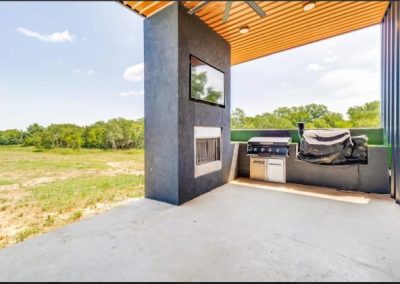Clementine-Ver9-back-porch-fireplace-4-bedroom-Texas-Barndominium-Photo