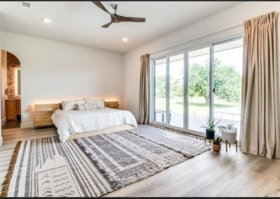 Clementine-Ver9-master-bedroom-with-panoramic-door-floor-plan-exterior-front-exterior-4-bedroom-Texas-Barndominium-Photo