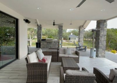 modified-virginia-backyard-patio-couch-4-bedroom-Texas-Barndominium-Photos