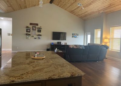 modified-clementie-v3-barndominium-Texas-Kitchen-Island-Living-Room