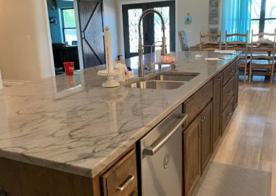 Modified Clementine barndominium 3250 sqft in Texas Finished Kitchen Island with a Prep Sink
